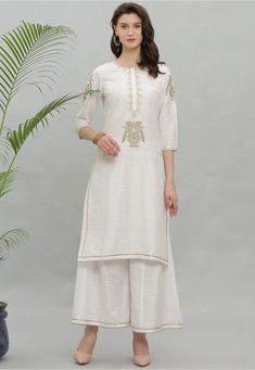 Art Dupion Silk Straight Kurta in White This Readymade attire is Enhanced with Resham and Zari Work and is Crafted in Round Neck and Quarter Sleeve Available with an Art Dupion Silk Palazzo in White Do note: Accessories shown in the image are for presentation purposes only and length may vary upto 2 inches.(Slight variation in actual color vs. image is possible). White Embroidered Palazzo Set For Wedding, Festive Off-white Palazzo Set With Embroidered Border, Off White Embroidered Palazzo Set With Straight Kurta, White Palazzo Set With Embroidered Border For Festive Occasion, White Chanderi Sharara With Floral Embroidery, White Palazzo Set With Embroidered Border And Straight Kurta, Diwali Traditional Straight Kurta With Embroidery, Embroidered Off White Chanderi Palazzo Set, White Sharara With Floral Embroidery Straight Kurta