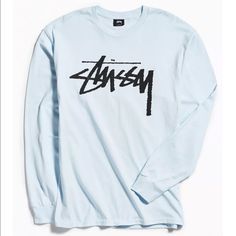 Nwot Urban Outfitters Stussy Old School Logo Long Sleeve Tee- Long Sleeve T-Shirt From Stussy Featuring A Logo Across The Chest. Heavyweight Cotton Is Cut In A Standard Fit Complete With Ribbed Banding At The Collar + Cuffs. Stussy Is A California-Based Streetwear Label That Delivers A Collection Of T-Shirts, Hoodies And Accessories, All Emblazoned With Shawn Stussy's Iconic Signature. Content + Care - Cotton - Machine Wash - Imported Tag Has Been Marked To Prevent In Store Returns H-02-24-22 Light Blue Graphic Top For Streetwear, Light Blue Graphic Print Top For Streetwear, Light Blue Cotton Streetwear Tops, Urban Outfitters Relaxed Fit Tops For Streetwear, Light Blue Relaxed Fit Top For Streetwear, Trendy Blue Long Sleeve T-shirt, Blue Long Sleeve Trendy T-shirt, Summer Long Sleeve Shirt With Logo Print, Urban Outfitters Blue Graphic Print Tops