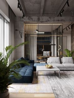 a living room filled with lots of furniture and plants on top of a wooden floor