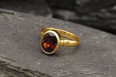 Gold Garnet Ring set with a Natural Garnet in a perfect diamond cut & a deep red color, at 10x8mm, 3 Carats, sourced from Mozambique. Red Antique Ring design made of Gold Vermeil ☞ thickest 18k Gold Plating on top of Solid 925 Sterling Silver ☞ made to last.☞ Choose your size ☞ I resize (before shipping) for FREE to Any size*Matching Earrings & Matching Pendant - please ask meJanuary Birthstone - Genuine & Natural Stones ❀⌛Last Ring left ⌛ ❀ Each Natural Gem is unique & will have Oval Faceted Birthstone Ring For Anniversary, Red Oval Ring With Bezel Setting, Red Oval Rings With Bezel Setting, Oval Solitaire Ruby Ring Gift, Oval Faceted Ruby Ring For Anniversary, Red Oval Hallmarked Birthstone Ring, Red Oval Birthstone Ring Hallmarked, Oval Ring Gold, Solitaire Ring Oval