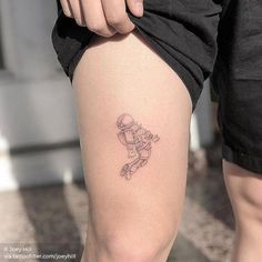 a person with a small tattoo on their leg