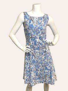 Get ready to turn heads in the Maggie Sleeveless Dress! This stunning dress features a beautiful floral print design and is crafted from a stretchy, comfortable fabric that will keep you feeling great all day long. Perfect for any occasion, this dress will make you look and feel your best. Details: Not lined Fabric content: 66% Viscose, 30% Nylon, 4% Elastane Care: Hand wash cold Made in Canada Sleeveless Blue Dress Stretch Mini Dress With Floral Print, Fitted Sleeveless Floral Sundress, Beach Sleeveless Stretch Dress With Floral Print, Stretch Sleeveless Floral Print Dress For Beach, Fitted Sleeveless Dress With Floral Print, Casual Stretch Sundress With Floral Print, Sleeveless Cotton Mini Dress With Floral Print, Sleeveless Stretch Midi Dress With Floral Print, Stretch Sleeveless Midi Dress With Floral Print