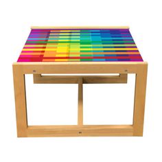 a wooden table with multicolored stripes on it's top and bottom edge