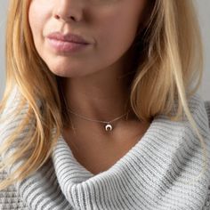 "Dainty upside down moon necklace. Perfectly balanced and totally cute. The ideal, minimal piece for everyday.  D E T A I L S: * Top quality moon charm - 3/8\" (9.5mm)  * Beautiful dainty chain * Photo shows a length of 14\" (XS neck)  M A T E R I A L S: * All sourced from USA or Italy * 100% sterling silver chain and moon charm * Comes in a cute little package ready for gifting HANDMADE WITH LOVE * All items are handmade with love in our happy Louisiana studio. * We use only highest quality, ethically sourced materials. * Committed to providing you with excellent customer service. SHIPPING UPGRADES We offer shipping upgrades should you need your order faster. They will be displayed as an option once you add an item in your cart. GIFTS & PACKAGING We want to be good to the planet, so we sh Sterling Silver Moon Phase Charm Necklaces, Minimalist Crescent Charm Necklace With Clavicle Chain, Minimalist Crescent Clavicle Chain Charm Necklace, Minimalist Crescent Moon Phase Charm Necklace, Minimalist Half Moon Phase Necklace, Minimalist Silver Moon Charm Necklaces, Silver Crescent Charm Necklace, Dainty Sterling Silver Half Moon Charm Necklace, Dainty Half Moon Sterling Silver Charm Necklace