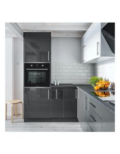 a kitchen with grey cabinets and white walls