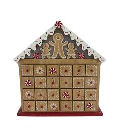 a gingerbread house is decorated with candy canes and cookies on it's roof