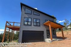 a two story house with an attached deck