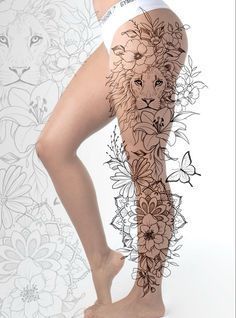 a woman's leg with flowers and a lion tattoo on it, in front of a floral background