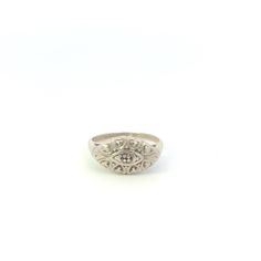 10K 1950's Oval Scalloped Ornate Statement Ring Size 5 White Gold *Weight: 2.4g *Composition: 10k GoldTested *Ring Size: 5 *Era: Vintage *Notes: There is a single stone missing from this ring Estimated Retail Replacement Value: $479.99 Please note: Unless otherwise noted, our items are solid gold (i.e. if it is listed as 14K Gold, it means it is solid 14K, not gold plated). Where applicable, all diamonds are graded according to GIA grading standards, the diamonds are NOT enhanced, unless noted. All gemstone weights are approximations based on measurements using industry accepted standards.   *GB000319* [CFXW] Vintage Diamond Cut Signet Promise Ring, Classic Engraved White Rings, Classic White Engraved Rings, Vintage Diamond Cut Signet Ring For Wedding, Vintage Diamond-cut Signet Promise Ring, Vintage Oval Signet Ring With Diamond Cut, Vintage Diamond Cut Signet Ring, Vintage White Gold Signet Ring Stamped 14k, Vintage Oval Diamond Cut Signet Ring