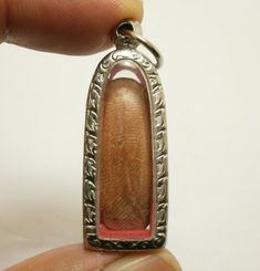 Phra Leela Kampang Amulet (Buddha walking over all Obstacles)Size : 1.5 x 4.4 cm. (Approx.)**Small size Pendant** This Unique amulet Phra Leela kampang . The amulet was made in KampangPetch province in northern part of Thailand. The first Phra Leela kampang MedKanoon was made 700 years ago. The miracle keep happenning from this amulet especially with life protection matters.Thai people always have this amulet to protect their life of themself and love ones. It also attract Wealth and Prosperity. Spiritual Rectangular Jewelry For Rituals, Rectangular Spiritual Jewelry For Rituals, Spiritual Rectangular Jewelry For Good Luck, Rectangular Spiritual Jewelry For Good Luck, Detachable Pendant Amulet Jewelry For Gift, Rectangular Spiritual Good Luck Jewelry, Spiritual Rectangular Good Luck Jewelry, Silver Rectangular Jewelry For Blessing, Hallmarked Amulet Jewelry Gift