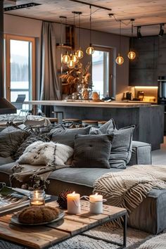 a living room filled with furniture and candles