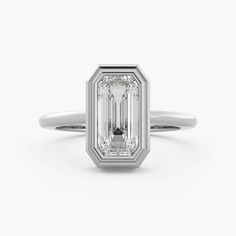 an emerald cut diamond engagement ring in white gold