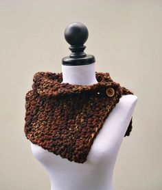 "Classic and chic, this cowl is a must have piece for any wardrobe. Hand crocheted in a melange of rust, gold, black and brown colored wool blend yarn, this cozy neckwarmer is adorned with a functional and beautiful handmade english yew wooden button. This item can be worn in a variety of ways. Completely reversible, the detail of this piece is just a bit different than your ordinary knitwear. This cowl measures 10 inches in width and 25 inches in length, unstretched. This item best fits the ave Chunky Knit Brown Yarn Knitting Pattern, Brown Chunky Knit Yarn Knitting Pattern, Brown Crochet Knitting Pattern For Fall, Cozy Brown Yarn Knitting Pattern, Cozy Hand-knitted Brown Knitting Pattern, Cozy Hand Knitted Brown Knitting Pattern, Cozy Brown Hand Knitted Pattern, Brown Crochet Knitting Pattern For Winter, Winter Crochet Knitting Pattern In Brown