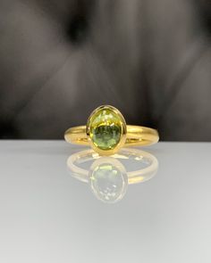 Natural Peridot Ring * Dainty Cabachon Ring * Genuine Peridot & 14K Solid Gold * Best Gift for Her/Him * Handmade Ring ◎ Details ◎ ○ Gemstone Details .Natural PERIDOT Oval Cut 9X7 mm approx. 2.01 ct ○ Gold Details 14K Solid Gold Width of Band : 2.50 mm Weight of Ring : approx 3.80 gr Made to Order HANDMADE ITEM ○ Upgrade to Solid 18K Gold, please click the link below: https://www.etsy.com/listing/962826004 For more CABACHON BEZEL rings : http://etsy.me/37fvI60 ○ PERIDOT RINGS : https://etsy. Classic Oval Cabochon Sapphire Ring With Bezel Setting, Classic Sapphire Ring With Oval Cabochon Bezel Setting, Classic Domed Yellow Gold Sapphire Ring, Classic Yellow Gold Domed Sapphire Ring, Gold Dome Cabochon Ring In 14k Gold, Yellow Gold Domed Sapphire Ring, Yellow Gold Domed Gemstone Ring, Gold Sapphire Ring Oval Cabochon With Polished Finish, 14k Yellow Gold Dome Ring With Oval Cabochon