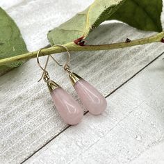 "Rose Quartz dangle gold earrings, Gemstone teardrop earrings, Beaded stone statement earrings Long dangle teardrop earrings featuring gorgeous Rose Quartz teardrops made with 14 K gold filled ear wires or lever back.           The Rose Quartz teardrop is about 1.18\" ( 30 mm ) long and the largest part of the teardrop is about 0.4\" ( 10 mm ) wide. These earrings can be made with 14 K gold filled ear wires or lever backs ( as shown in the pictures ) and the earrings full length is about 1.6\" ( Lock Charm Necklace, Beaded Sunglasses, Blue Gemstone Necklace, Sunglasses Necklace, Pink Crystal Earrings, Eyeglass Necklace, Rose Gold Quartz, Earrings Gemstone, White Pearl Necklace