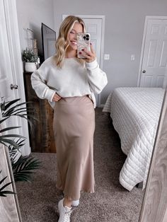 Our Sweet and Chic Skirt features a mushroom beige hued satin material, high waisted fit, side zipper with clasp, no stretch in waist, forgiving straight style fit, true midi length. Model is 5'1", 34DD, 6-8/28 and is wearing a size medium. Item runs true to size. More details: 100% satin. hand wash or wash on cold and hang to dry. Cream Midi Skirt For Fall, Fall Cream Midi Skirt, Cream Relaxed Fit Skirt For Fall, Chic Skirt, Chic Skirts, Satin Midi Skirt, Satin Material, Midi Length, Side Zipper