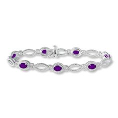 This vivacious bracelet for her features oval amethysts accented with round diamonds. Crafted in sterling silver, the 7-inch bracelet fastens with a tongue clasp. Purple Jubilee Tennis Bracelet, Elegant Purple Tennis Bracelet, Classic Amethyst Bracelets, Elegant Purple Sterling Silver Jubilee Bracelet, Elegant Purple Sterling Silver Bracelet For Formal Occasions, Elegant Formal Purple Sterling Silver Bracelet, Elegant Purple Sterling Silver Bracelet, Xoxo Bracelet, Modern Silver Jewelry