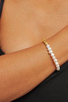 Elevate your wrist game with our Zarina Pearl Mix Bracelet – a stunning blend of pearls and gems crafted to adorn your wrist with timeless elegance. Picture yourself effortlessly commanding attention at every turn, your wrist adorned with lustrous pearls and shimmering gems, a symbol of your unique style and sophistication. Embrace the power of femininity with every flick of your wrist as this bracelet whispers tales of timeless beauty and grace. Pearl White Bracelets With Pearl Drop For Party, Pearl White Bracelet With Pearl Drop For Party, Minimalist Pearl Bangle Jewelry, Pearl Drop Bracelet Jewelry, Pearl Bracelet With Pearl Charm For Formal Occasions, Minimalist Pearl Jewelry With Oyster Bracelet, Pearl Bracelet With Pearl Drop, Pearl Bracelets With Pearl Charm For Parties, Pearl White Pearl Bracelet Jewelry