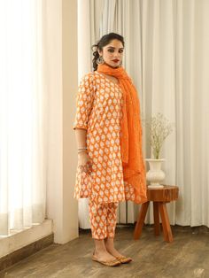 Beautiful handcrafted straight kurta pants set in pure cotton with lovely matching cotton doriya dupatta that is rightly finished with mirror embroidery. Color: Orange Fabric: Cotton and Kota Doria Note: Length and sizes can be customised Length - Kurta 40 inches Pants 38 inches Available in other colors If you happen to see some deformity in hand-work or fabric, that’s mere the technique of the same and not a defect. The garment is quite premium. The product will be delivered within 20-25 days Orange Chikankari Embroidery Palazzo Set For Diwali, Diwali Orange Chikankari Embroidery Palazzo Set, Navratri Orange Chikankari Palazzo Set, Traditional Drape Cotton Palazzo Set, Unstitched Orange Kurta With Gota Work, Orange Kurta With Printed Motifs For Diwali, Diwali Orange Kurta With Printed Motifs, Orange Printed Motifs Kurta For Navratri, Orange Kurta With Printed Motifs For Navratri