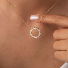 Adorn yourself with our exquisite 14k Gold and Diamond Circle Necklace. Available in a small size, this floating diamond circle pendant symbolizes the everlasting Circle of Life. Whether worn as a statement piece or for everyday elegance, this gold circle necklace radiates timeless beauty. Embrace the allure of this captivating accessory and order now. Alternatively, choose from our options of lab-grown diamonds or dazzling moissanites at three different price points to fit your unique preferenc Gold Circular Diamond Necklace As Gift, Yellow Gold Diamond Necklace With Halo, Yellow Gold Diamond Necklace With Halo Round Cut, Cubic Zirconia Open Circle Halo Jewelry, Yellow Gold Open Circle Halo Jewelry, Halo Cubic Zirconia Open Circle Jewelry, Gold Diamond Circle Jewelry, Gold Circular Diamond Jewelry, 14k Gold Open Circle Jewelry For Anniversary