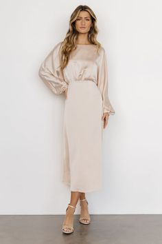 Nessa Lace Midi Dress | Blush | Baltic Born Winter Dresses To Wear To A Wedding Classy Beautiful, Champagne Bridesmaid Dress Modest, Long Sleeve Champagne Bridesmaid Dress, Beige Dress Long Sleeve, Mid Length Mother Of The Bride Dresses, Champagne Long Sleeve Bridesmaid Dresses, Taupe Satin Dress, Sunday Church Dresses, Modest Gold Dress