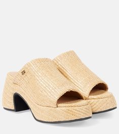 Butterfly raffia platform mules in beige - Ganni | Mytheresa Chic Beige Straw Mules, Chic Natural Mules With Woven Sole, Modern Platform Slippers With Textured Sole For Beach, Modern Beach Mules With Leather Sole, Summer Open Toe Platform Slippers With Leather Sole, Elegant Platform Mules For Beach, Elegant Beach Mules With Platform, Elegant Platform Mules For The Beach, Chic Beige Open Toe Clogs