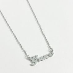 Our best selling personalised name necklace in silver is what we dream about. This necklace is the perfect every day name necklace. This silver name necklace is crafted from high quality stainless steel for a water and tarnish resistant finish. You can wear this custom piece every day. Custom Name Silver Jewelry In Stainless Steel, Silver Stainless Steel Custom Name Jewelry, Silver Nickel-free Nameplate Necklace, Silver Stainless Steel Necklace For Personalized Gift, Personalized Silver Stainless Steel Necklace, Classic Personalized Stainless Steel Necklaces, Customizable Silver Stainless Steel Necklace, Personalized Stainless Steel White Gold Necklace, Silver Nickel-free Nameplate Necklaces