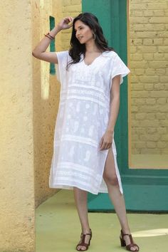 Whether you are relaxing at home strolling a beach boardwalk or sipping a spritz in an Italian cafe this cool and comfortable shift dress is just the ticket. Designed by India's Shalabh the deep v-neck dress features cap sleeves covered buttons on the bodice and traditional chikankari hand embroidery. Casual Short Sleeve Resort Cover-up, Summer Daywear Relaxed Fit Cover-up, Summer Relaxed Fit Daywear Cover-up, Summer Relaxed Fit Cover-up For Daywear, Casual Tunic Beach Dress, Casual Tunic Beach Dress For Vacation, Casual Vacation Tunic Cover-up, Casual Tunic Cover-up For Vacation, Casual Tunic For Summer Beach Cover-up