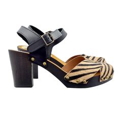 A soft model, with clean and elegant lines, these sandals are a real passe partout. Clogs with Brown Wood effect base Upper with crossed bands in genuine Tuscan leather, zebra effect Adjustable ankle strap, open toe Anti-slip suede insole Heel height 7 cm with 2 cm platform Entirely made in Italy Craftsmanship. BEFORE COMPLETING YOUR PURCHASE DO NOT FORGET TO CHECK THE SIZE! Chic Sandals With Cross Strap And Removable Insole, Brown Sandals With Heel And Cross Straps, Brown Cross Strap Sandals With Heel Strap, Chic Cross Strap Sandals With Removable Insole, Brown Strap Sandals With Block Heel, Leather Sandals With Padded Heel And Cross Strap, Beach Slingback Sandals With Wooden Heel And Ankle Strap, Brown Block Heel Sandals With Strap, Open Toe Sandals With Wooden Heel For Beach