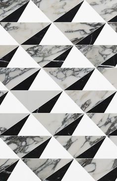 black and white marble tiles with triangular shapes