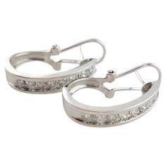 Vintage 14K White Gold Diamond Hoop Earrings This gorgeous set of hoops were crafted from 14K white gold and feature 16 sparkling round brilliant cut diamonds! Approximate total diamond weight: .72 cts Diamond color: I Diamond clarity: I1-I2 Size: 22.46mm X 14.2mm X 4.8mm Weight: 3.6 dwt/ 5.6 g Hallmark: SB 14K Very good condition, professionally polished. Will come packaged in a gift box or pouch (when possible) and will be shipped U.S. Priority Mail Insured. MM122623/17KCS Gold Diamond Hoop Earrings, Diamond Hoop Earrings, Jewelry Earrings Hoops, Round Brilliant Cut Diamond, Diamond Clarity, Classic Elegance, Brilliant Cut Diamond, White Gold Diamonds, Round Brilliant