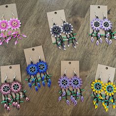 six pairs of earrings with flowers on them