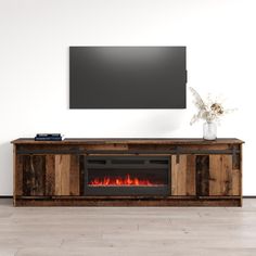 a television stand with a fireplace in it