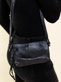 This small crossbody bag features an adjustable strap to allow versatility in styling. A fold over flap hides a zippered closure to keep all of your necessities safe and sound! Measures approx. 7 1/2" L x 4 1/2" H Fall Flap Satchel With Adjustable Strap, Casual Black Crossbody Flap Bag, Black Travel Flap Bag With Fold Over Clasp, Versatile Adjustable Crossbody Shoulder Bag, Adjustable Leather Crossbody Bag, Black Crossbody Saddle Bag, Black Flap Saddle Bag With Adjustable Strap, Black Flap Bag With Adjustable Strap, Leather Shoulder Bag With Fold Over Clasp For On-the-go