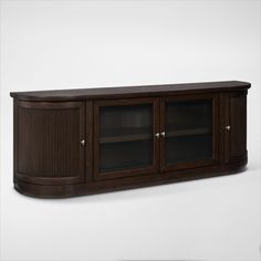 a wooden entertainment center with glass doors on the front and side panels, in dark wood