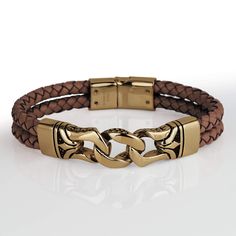 This stylish men's bracelet features a braided genuine brown leather strap with premium grade 316L solid stainless steel, fused with an 18k yellow gold finish. Fits up to an 8" wrist, magnificent presentation case included. Modern Brown Leather Bracelet For Formal Occasions, Brown Metal Bracelet For Formal Occasions, Modern Brown Bracelets For Formal Occasion, Elegant Brown Stainless Steel Jewelry, Formal Brown Leather Strap Bracelet, Luxury Gold Bracelets With Leather Strap, Modern Brown Jewelry With Leather Strap, Luxury Gold Leather Bracelets, Formal Brown Metal Bracelet