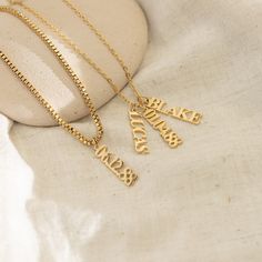 Uplift your jewelry collection with our elegant Vertical Personalized Name Necklace. Perfect for the fashion-savvy, its customized engraving and 18k Gold composition fuse timeless charm with lasting quality. Materials & Finish: * High-Quality Stainless Steel * 18k Gold, Silver Our Products are different from regular gold plating because it is a THICK layer of 18k solid gold on stainless steel, making it more durable. It offers the appearance and quality of gold jewelry at a more affordable cost. Initial Pendant Charm Necklace Gift With Box Chain, Initial Pendant Jewelry Box Chain As Gift, Gift Initial Pendant Charm Necklace With Box Chain, Personalized Gold Jewelry With Box Chain, Gold Box Chain Necklace For Mother's Day, Personalized Gold Box Chain Jewelry, Charm Pendant Necklace With Box Chain As Gift, Mother's Day Gift Box Chain Jewelry, Mother's Day Gift Jewelry Box Chain