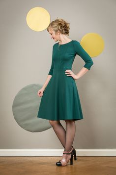 A real favorite dress! Carrie is an elegant dress with fine, vertical tucks in the front and a swinging circle skirt. Made of elegant Romaniter jersey in dark green. The waist is emphasized with a narrow cuff. The dress is available in many colors, please look at the Romanitjersey color chart. Length approx. 100 cm. The dress is available in sizes 36-42. We also make the dress according to your measurements. Please include your chest, waist and hip circumference as well as your height. used mate Green A-line Midi Dress, Formal Green A-line Dress, Elegant Green A-line Dress, Green A-line Dress With Fitted Bodice, Green A-line Formal Dress, Green Fit And Flare Dress For Evening, Green Fit And Flare Evening Dress, Chic Dark Green Knee-length Dress, Dark Green Fitted Dress For Formal Occasions