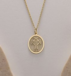 Gold Celtic Cross  Pendant - Celtic Cross Gold Necklace ● Material of pendant: Solid Gold 14k ( REAL GOLD ) ● Metal Stamp: 14k ( REAL GOLD ) ● The pendant is available in 5 sizes: - 12x17 mm / 0,47 x 0,66 inches - 13x18 mm / 0,51 x 0,70 inches  In the photos - 14x19 mm / 0,55 x 0,74 inches  - 16x21 mm / 0,62 x 0,82 inches  - 18x24 mm / 0,70 x 0,94 inches ( In the photos the size is 13x18 mm / 0,51 x 0,70 inches ) ( Jump Ring inner diameter: 4 mm ) ● Material of chain: Solid gold 14k ( REAL GOLD ) It is thin and dainty and it is available in 4 sizes: - 40 cm / 15,75 inches ( Length ) - 45 cm / 17,72 inches ( Length ) In the photos - 50 cm / 19,68 inches ( Length ) - 55 cm / 21,65 inches ( Length ) ● Backside engraving is FREE ( Please use the personalization box for that.) ● If you want lar Gold-tone Oval Necklace For Gift, Yellow Gold Cross Necklace Tarnish Resistant, Hallmarked Yellow Gold Cross Pendant Necklaces, 14k Gold Locket Necklace For Memorial, Durable Gold Oval Necklace, Hallmarked Yellow Gold Cross Pendant Jewelry, Hallmarked Pendant Necklace For Memorial, Gold Cross Necklace Fine Jewelry, Gold Engraved Oval Pendant Necklace