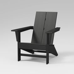 a black chair sitting on top of a white floor