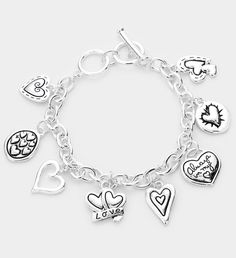 This beautiful charm bracelet is so pretty and the silver makes it go with any outfit. If you aren't getting this for yourself, this bracelet is a perfect gift for a loved one- mother, grandmother, or significant others are sure to love this piece. Valentine's Day Gift Charm Bracelet With Dangling Charms, Adjustable Charm Bracelet For Mother's Day, Adjustable Metal Charm Bracelet For Valentine's Day, Heart Bracelet For Friendship And Mother's Day, Metal Charm Bracelet For Anniversary On Valentine's Day, Silver Sterling Silver Charm Bracelet For Mother's Day, Metal Bracelets For Friendship On Mother's Day, Valentine's Day Bracelet Jewelry Gift For Mom, Valentine's Day Jewelry Bracelet Gift For Mom