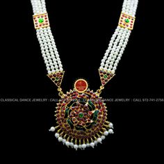 Original Design by Classical Dance Jewelry® ❥ Pearl Kempu moti mala Long Haram Chain is traditional and ethnic South Asian Indian Jewelry. ❥ Traditional Padakkam Peacock Style Pendant Pearls Kempu and white stone Long Necklace ❥ You Can wear this set for Bharatnatyam Kuchipudi Dance Performances, Engagement, Weddings, Birthdays, festivals, puja, Ammavaru Amman decorations, Durgamata Decoration ❥ Handmade Indian Traditional Item. ❥❥❥ Set has variations please CHECKOUT Variants ☛ Long Necklace wit Traditional White Kundan Necklace With Latkans, Traditional Chandbali Bridal Necklace For Puja, Multicolor Temple Necklace For Puja Festivals, Ceremonial Temple Jewelry Bridal Necklace For Festivals, White Temple Necklace For Diwali, White Temple Jewelry For Diwali, Festive White Temple Necklace For Diwali, Traditional Bridal Necklace For Festivals, Temple Style Kundan Necklace With Tilla For Puja