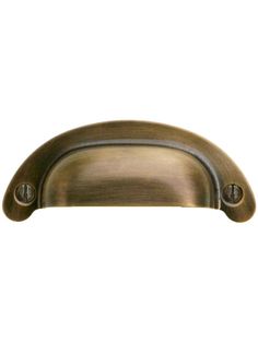 an antique brass cabinet door handle on a white background with clipping for text or image