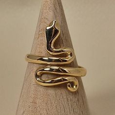 Simple, elegant handmade ring in shape of snake The ring is made of 18 carat solid yellow gold It's an adjustable ring from size U.S 6.1/2 to 9.00 Snake was the symbol of health in ancient Greece The ring is made in Greece in our workshop in Athens An elegant classic piece of jewelry SHIPPINGINFORMATION FREE SHIPPING VIA DHL EXPRESS Please fill an active phone number It is required by the courier company DELIVERY INFORMATION 1-3 Working days To EUROPE 3-5 Working days To U.S.A, and CANADA 5-8 Wo Elegant Gold Snake Ring In Brass, Elegant Gold Brass Snake Ring, Yellow Gold Brass Snake Ring For Gift, Yellow Gold Brass Snake Ring As Gift, Elegant Gold Snake Ring, Formal Yellow Gold Snake Ring, Adjustable Gold Snake Ring, Adjustable Symbolic Snake Ring, Elegant Yellow Gold Snake Ring