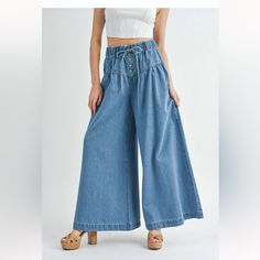 80% Rayon, 20% Polyester Rise: 12" (Approx.) Inseam: 29" (Approx.) Pleated Yoke Detail Elasticized Waist Adjustable Drawstring Button Down Front Back Pockets Wide Leg Model Is 5'8" Wearing A Size Small Boho Super Wide Leg Pants, Leg Model, Small Boho, Denim Blue, Flare Jeans, Leg Pants, Wide Leg Pants, Blue Denim, Wide Leg