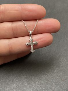 "Tiny Sterling Silver Cross CZ Necklace Minimalist and Dainty Metal: All components are made from solid .925 Sterling Silver Stone: Cubic Zirconia Measurement: pendant height is 21mm (0.83\") and 12mm (0.47\") wide Choose Chain Length At Checkout You can find other cross jewelry in my shop here https://www.etsy.com/shop/LinksAndStones?ref=seller-platform-mcnav&section_id=24376960 Please feel free to Convo me with any questions before purchasing. Please view policy before purchasing Thank You Sterling Silver Crucifix Necklace For Jewelry Making, Silver Cross Jewelry For Her, Dainty Sterling Silver Cross Jewelry, Silver Cross Jewelry As Gift For Her, Silver Sterling Silver Cross Necklace For Gift, Sterling Silver Cross Necklace Gift, Silver Cross Necklace Perfect As A Gift For Her, Silver Cross Necklace For Her, Silver Cross Jewelry Gift For Her