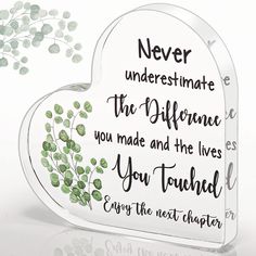 a heart shaped glass plaque with the words never underestimate, the difference you made and the lives you turned