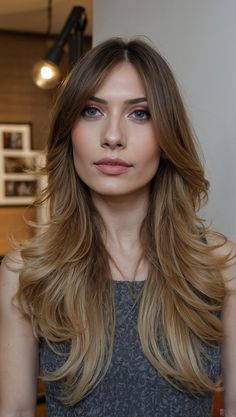 This layered cut is all about volume and texture. Long layers create a cascading effect, adding depth and movement that make the hair look fuller. The slightly tousled ends give it a laid-back feel, while the face-framing layers bring attention to your best features. Layered Cut