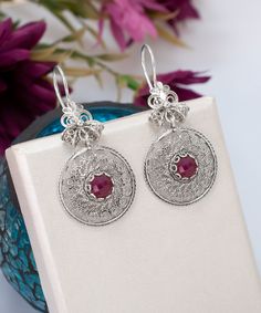 Ruby Corundum Dangle Silver Earrings Boho, 925 Sterling Gemstone Earrings Artisan Made Filigree Dream Catcher Earrings, Women Handmade Jewelry Drop Earrings Handcrafted Earrings Material: 925 Sterling Silver ( NICKEL FREE ) Length and Width: 4.8cm X 2.2cm // 1.9 Inch X 0.86 Inch Gemstone: Ruby Corundum 6mm. FREE, FAST AND TRACKABLE SHIPPING FOR ALL EU COUNTRIES AND USA. They have a circle shape which called dream catcher jewels and has a stunning ribbon top of the earrings that add the perfect s Ornate Gemstone Earrings In Sterling Silver, Ornate Sterling Silver Gemstone Earrings, Ruby Earrings With Intricate Design As Gift, Red Sterling Silver Filigree Earrings, Elegant Sterling Silver Danglers As Gift, Elegant Sterling Silver Danglers For Gift, Elegant Sterling Silver Danglers For Festive Occasions, Elegant Silver Round Danglers, Silver Round Danglers In Elegant Style