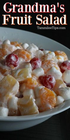 grandma's fruit salad with oranges and cranberries in a white bowl